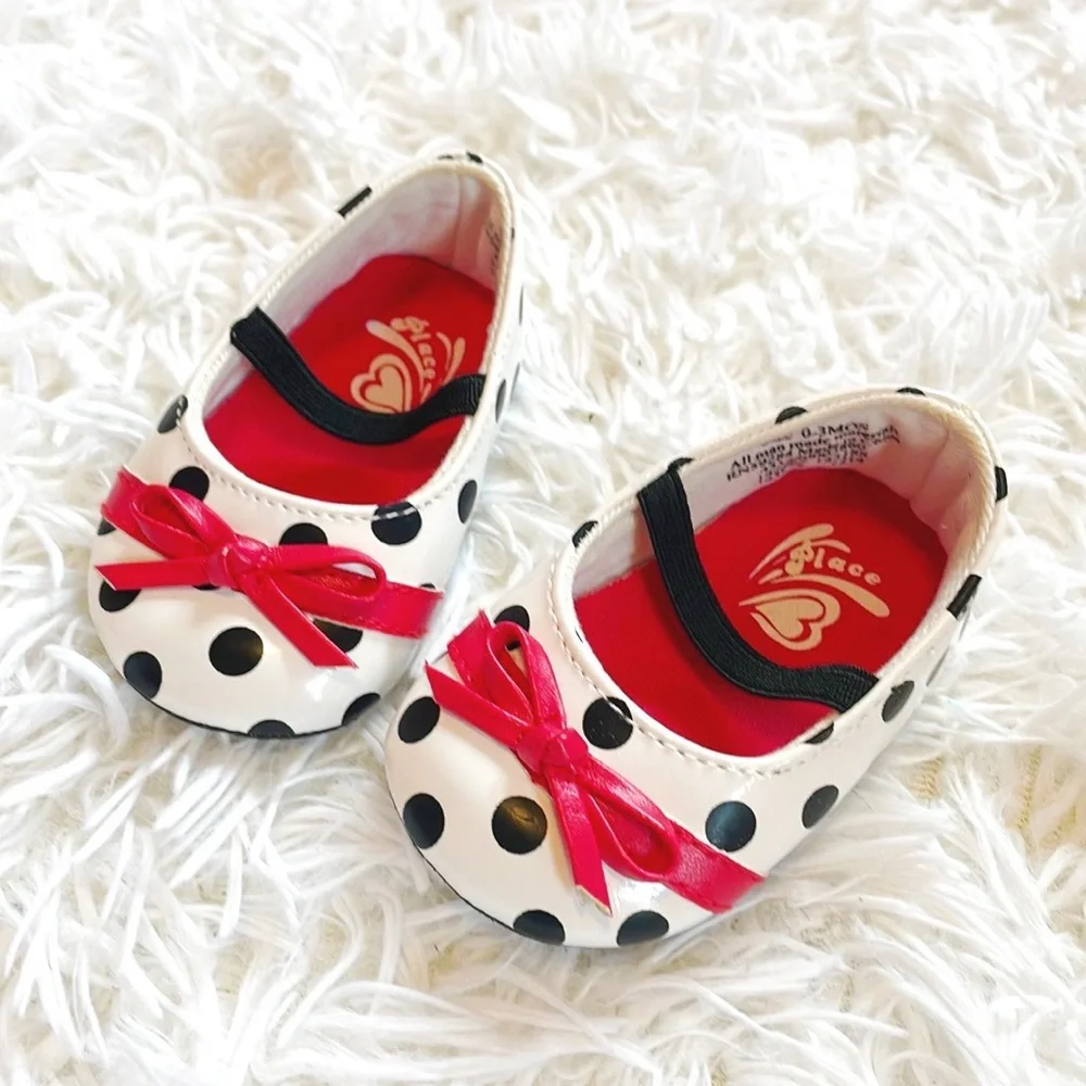 Place • Black and White Baby Polka Dot Mary Janes with Red Bow Accent Detailing